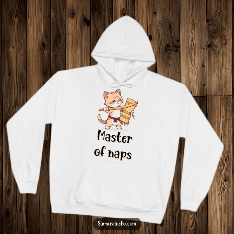 Funny hoodie depicting a cat comically sparring with a straw dummy, embodying a tiny warrior's hilarious and determined spirit.