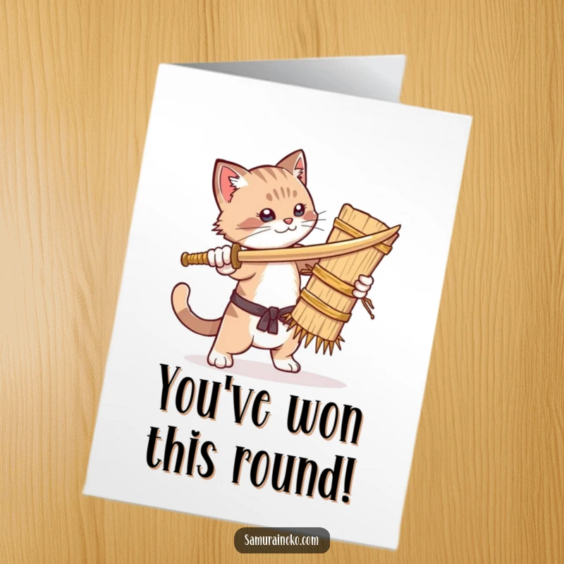Funny Free Printable Congratulations Card: A victorious cat playfully attacks a straw dummy with a wooden sword.