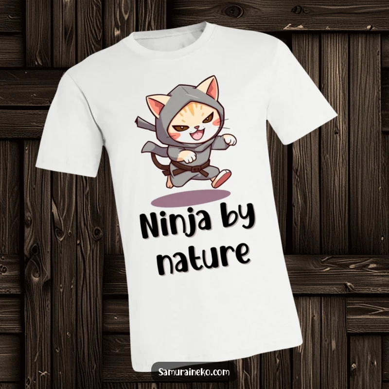 Funny Cat Ninja T-Shirt depicting a cat dressed as a ninja, leaping from a shadow with a sly, mischievous grin.