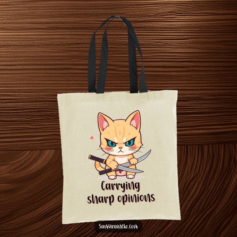 Funny tote bag with a determined cat drawing a small katana, ready to tackle any task with sharp focus and feline grace.