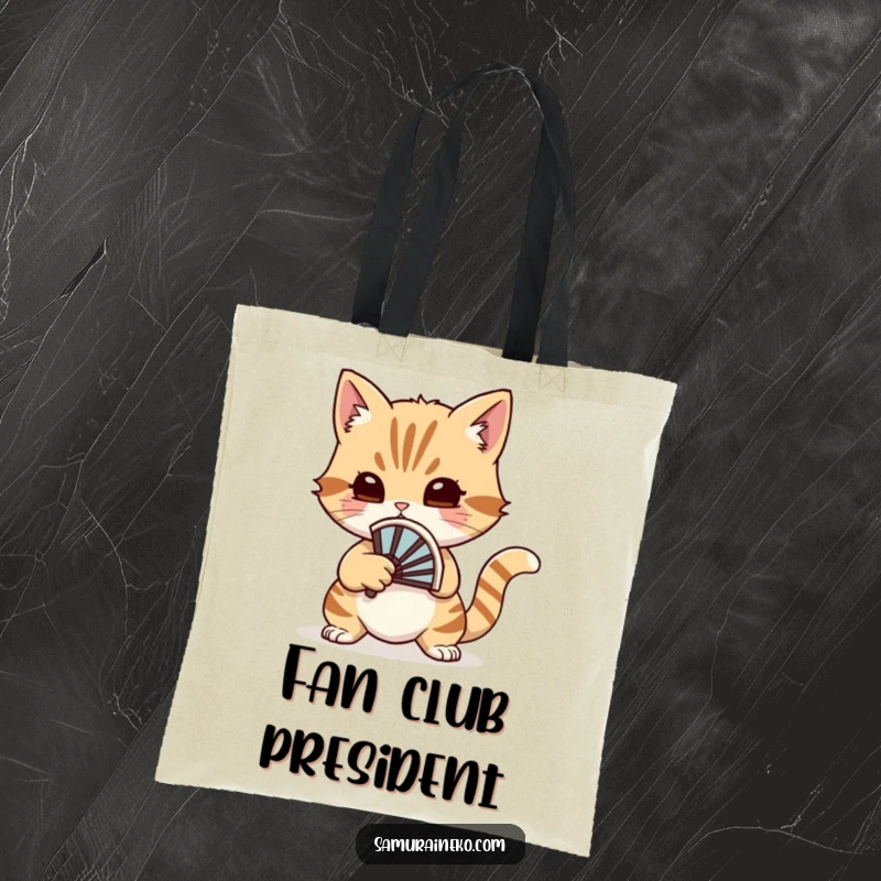 Funny cat fan warrior tote bag featuring a cat ready for a whimsical duel with a small battle fan.