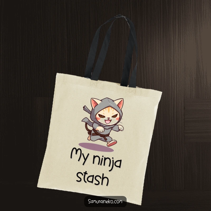 Funny Cat Ninja Tote Bag depicting a cat ninja leaping from shadows with a mischievous grin, ideal for carrying items discreetly.